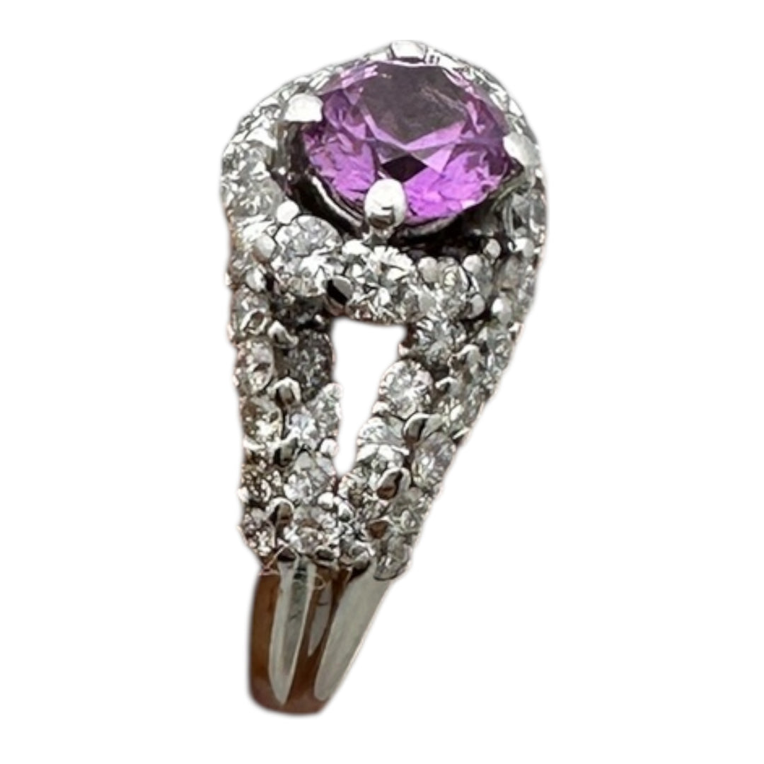 ￼ 14 karat white gold, pink, sapphire, and diamond Paved halo split shank ring