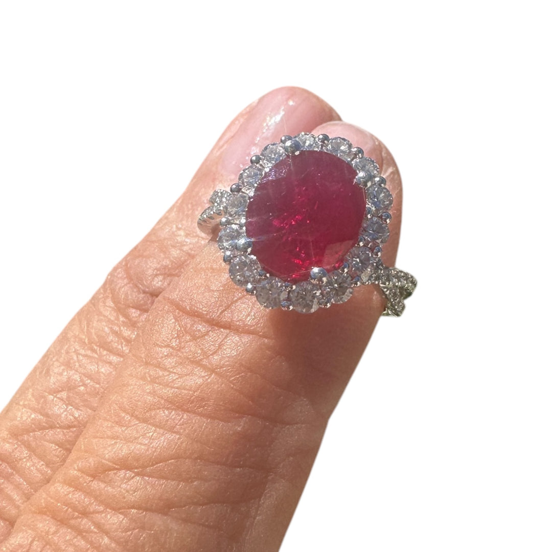 18 karat white gold, 3.58 ct ruby, and diamond halo ring.