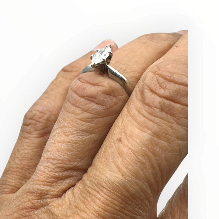Classic .41 carat marquise–shaped diamond solitaire ring in 14 karat white gold