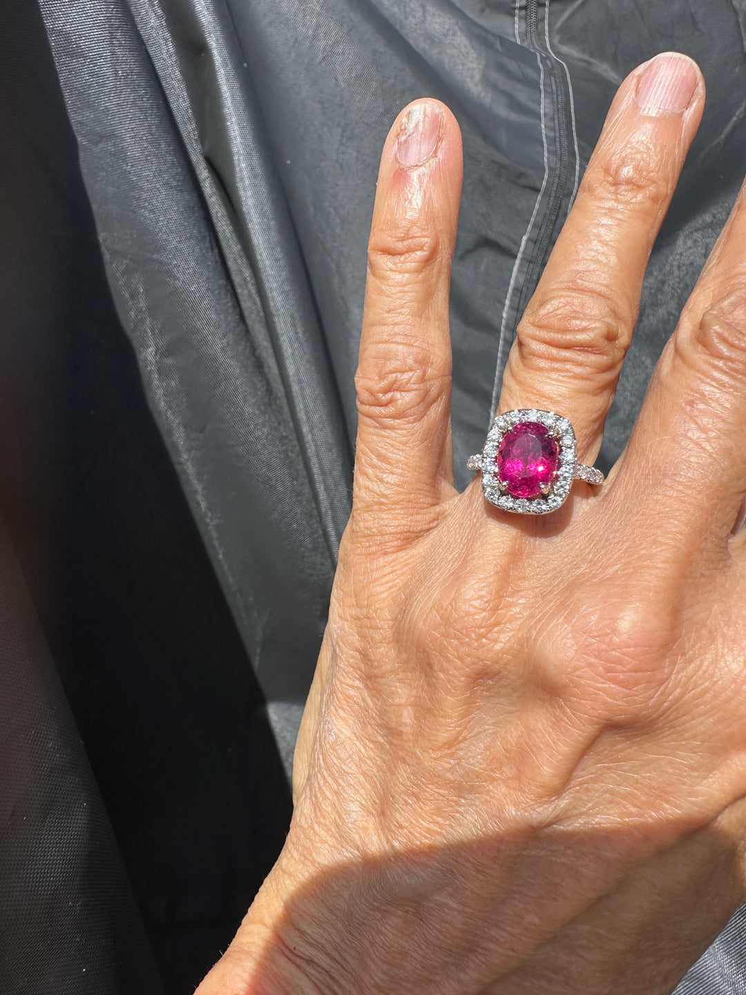 18 karat white gold, 6 carat pink tourmaline and diamond halo ring