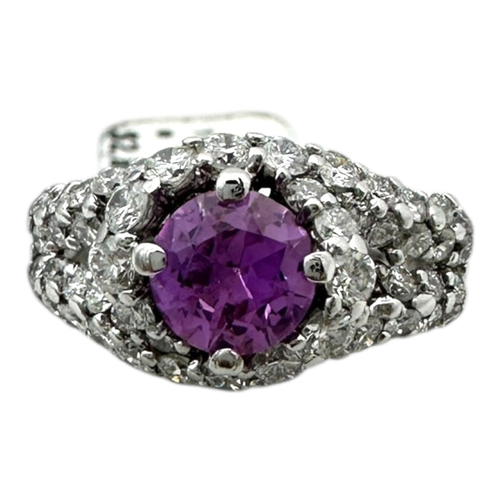 ￼ 14 karat white gold, pink, sapphire, and diamond Paved halo split shank ring