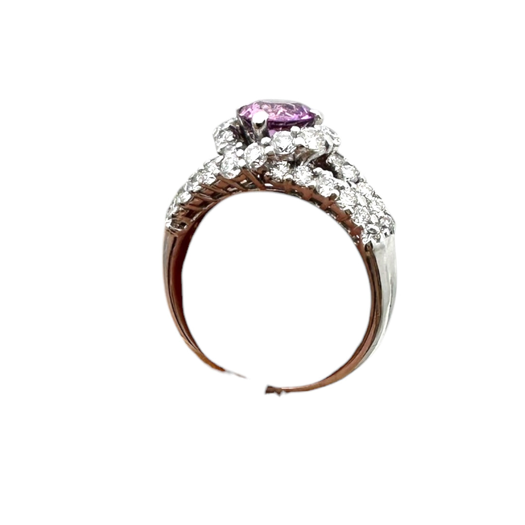 ￼ 14 karat white gold, pink, sapphire, and diamond Paved halo split shank ring