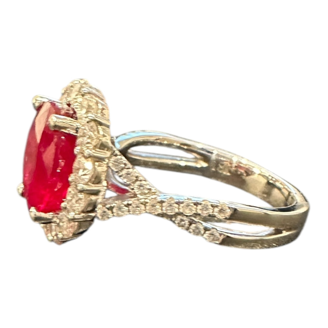 18 karat white gold, 3.58 ct ruby, and diamond halo ring.