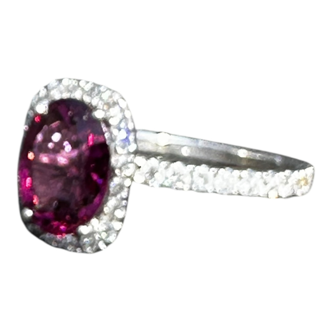 14 karat, 2 carat purple Tourmaline and diamond halo ring