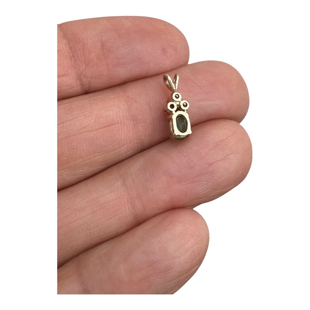 14 Karat yellow gold diamond and emerald pendant