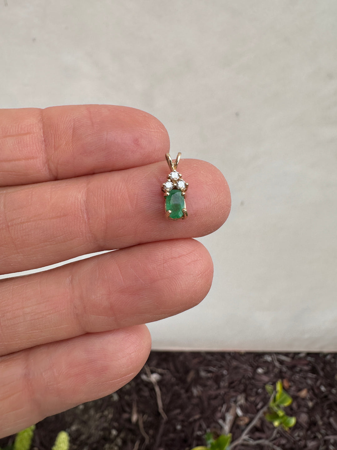 14 Karat yellow gold diamond and emerald pendant