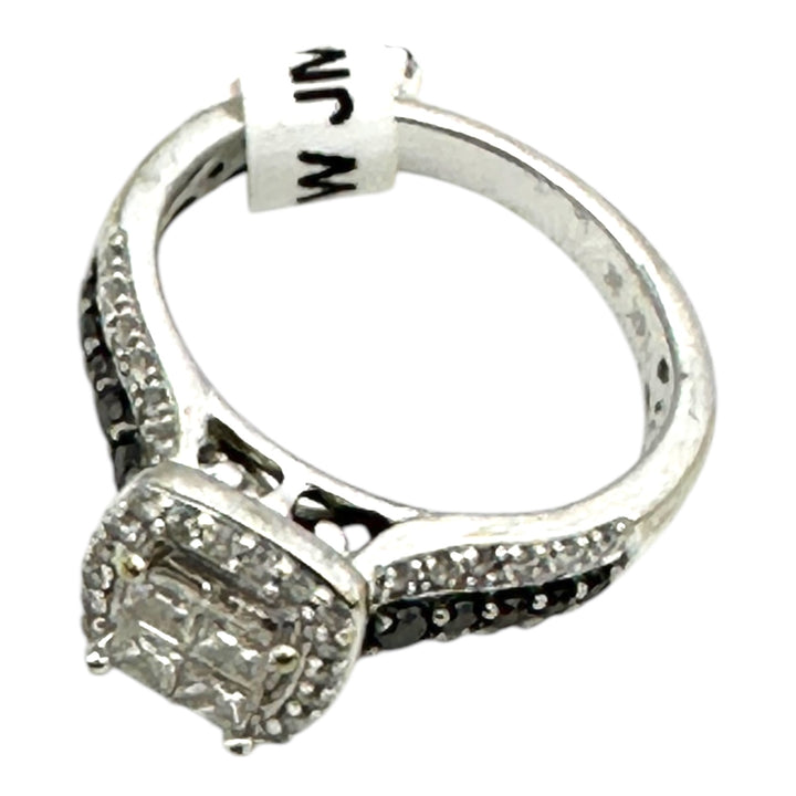 14 karat white gold, 1.25 Carat halo, black, and white diamond ring