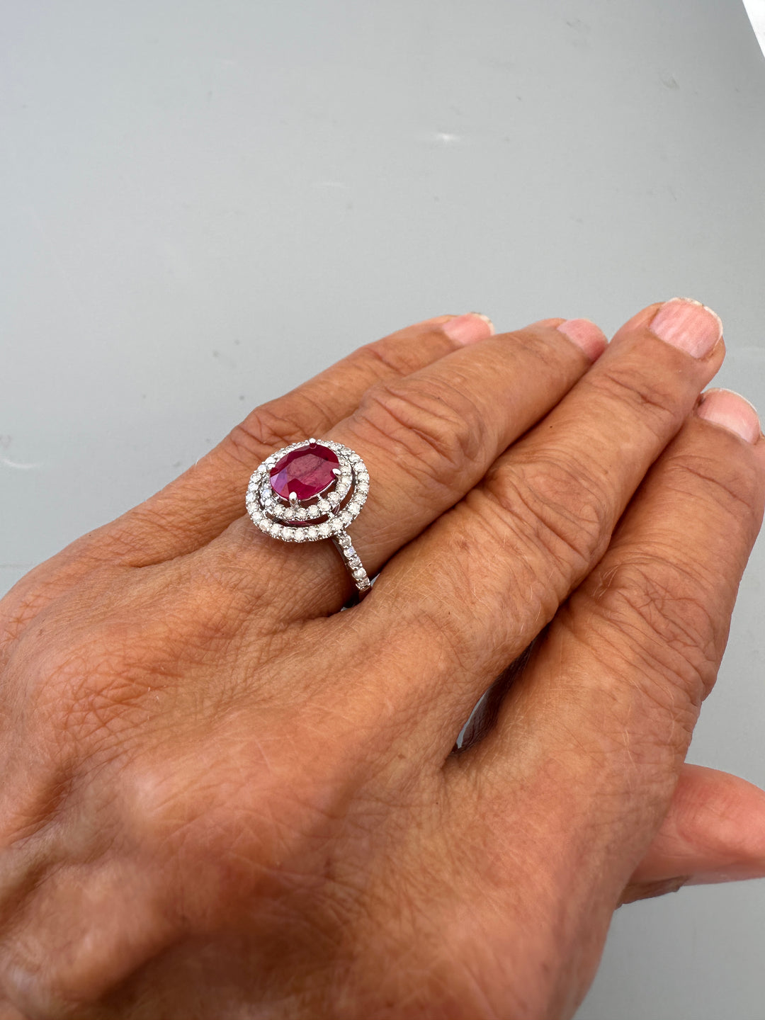 14kt White Gold 1.40 Carat Oval Ruby and Double Diamond Halo Cocktail Ring