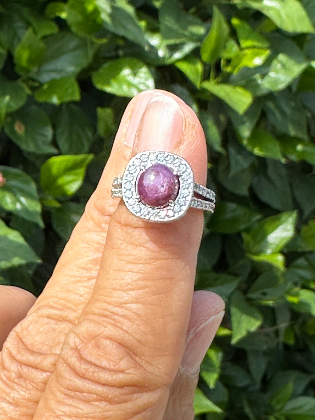18 karat white gold star ruby halo diamond ring