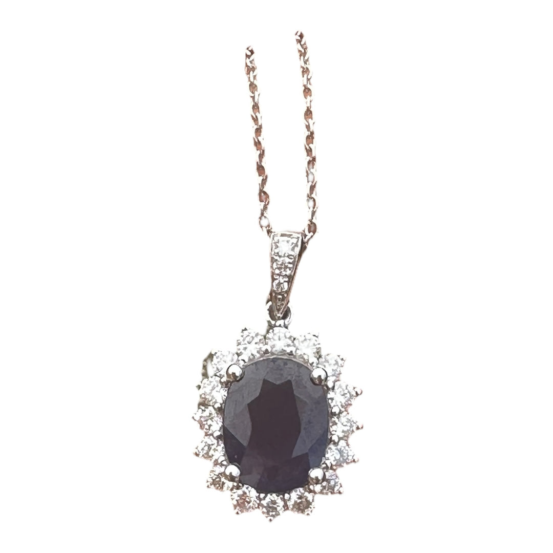14 karat white gold 2.90 carat sapphire and Diamond Halo, pendant, and chain ￼