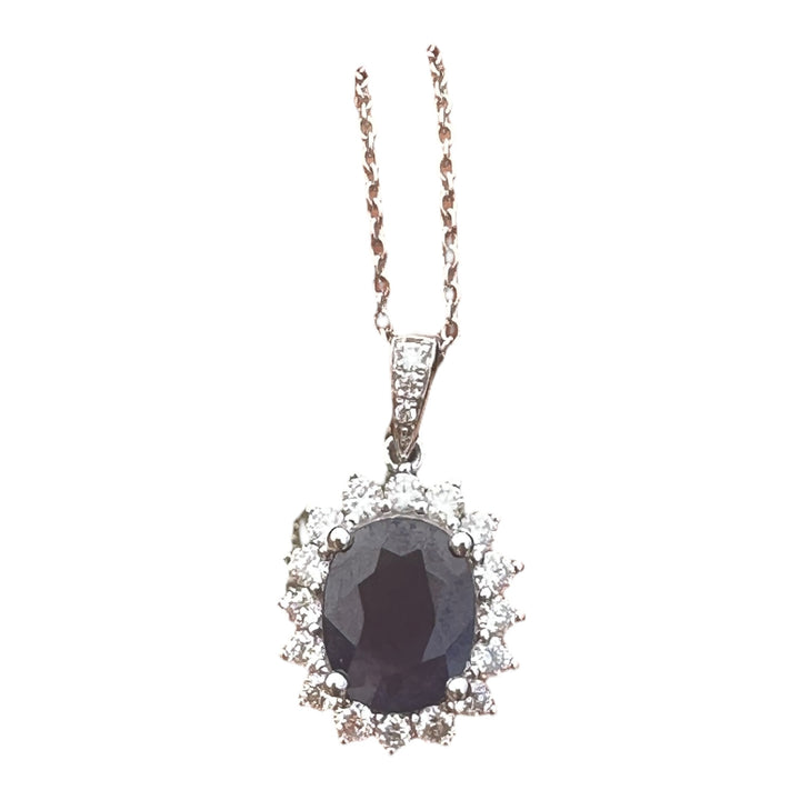 14 karat white gold 2.90 carat sapphire and Diamond Halo, pendant, and chain ￼
