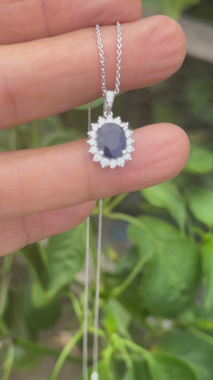 14 karat white gold 2.90 carat sapphire and Diamond Halo, pendant, and chain ￼
