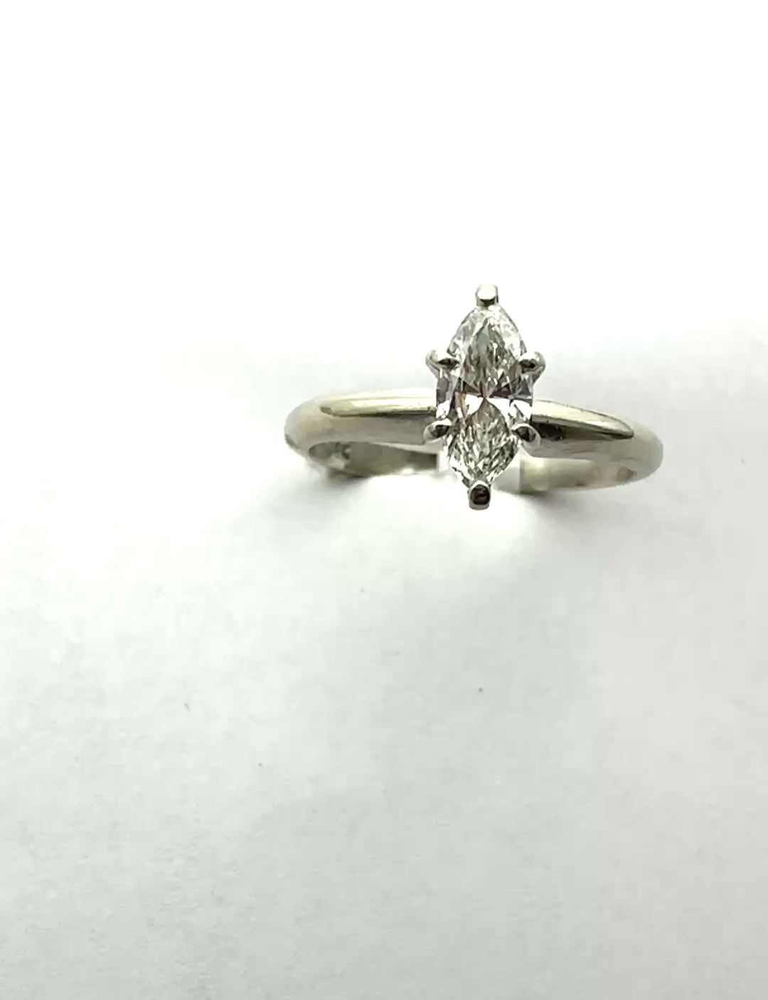 Classic .41 carat marquise–shaped diamond solitaire ring in 14 karat white gold