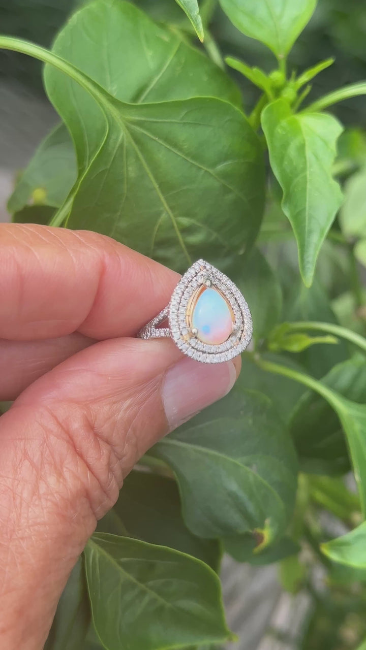14 karat halo opal ring .80 carat diamond.