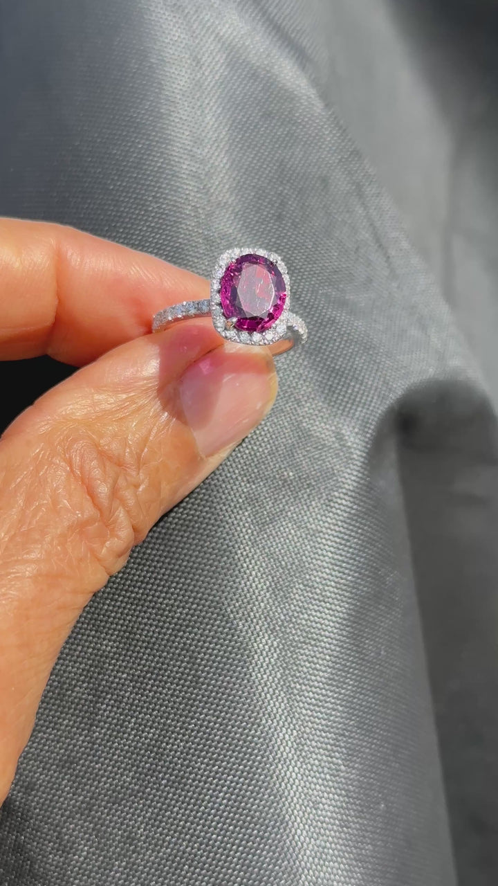 14 karat, 2 carat purple Tourmaline and diamond halo ring