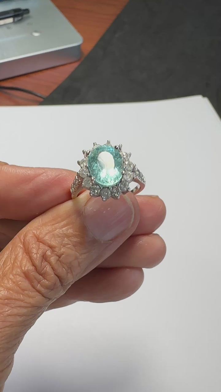 14 karat white gold neon 4.50 Carat Paraiba Tourmaline halo diamond ring